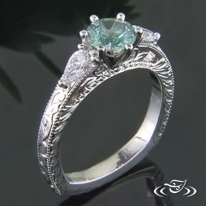 Platinum ring deals with green stone